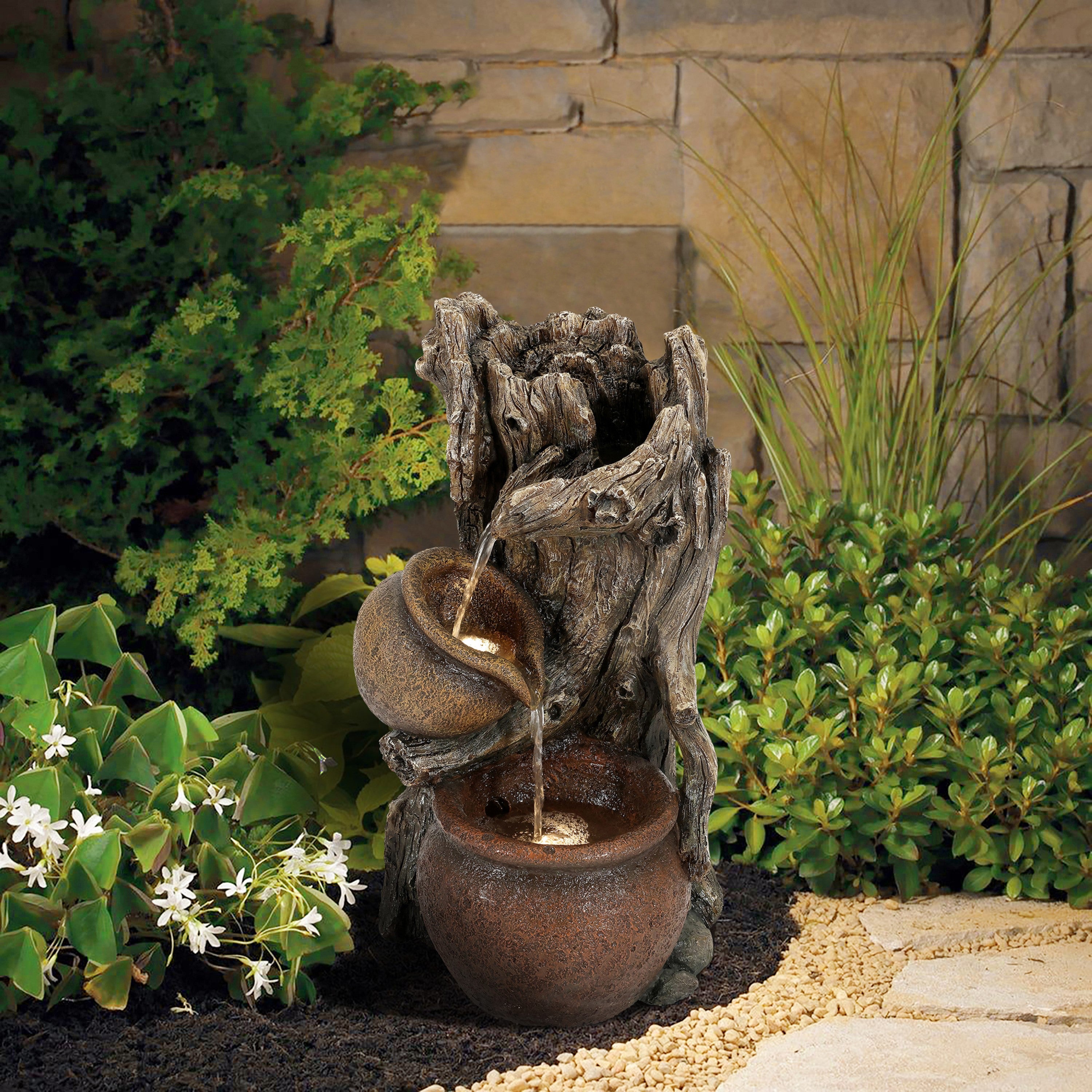 water-fountain-and-a-pot-in-a-garden-setting