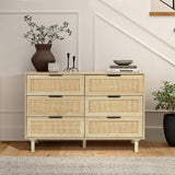 zahra dresser in light wood tone and rattan door, vase and candle holder on top, planter by the side. In a entryway set up