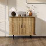 Mid-Century Modern Accent Cabinet featuring slatted tambour doors, topped with a lamp, decorative vase, teapot, and plant arrangement. The oak grain finish complements the rooms light walls and wooden floor, with sunlight casting gentle shadows.