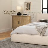 A bedroom with a beige bed, gray blanket, and a wooden nightstand featuring an oak grain finish. A lamp and abstract art sit on the nightstand against a white brick wall. Text reads Versatile for any space.