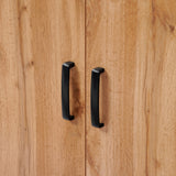 Close-up of two black handles on the Randolph wood accent sideboard by LuxenHome, featuring a modern walnut finish with light brown grain. The vertical handles are near the center seam of the cabinet doors, adding functionality and style to your storage space.