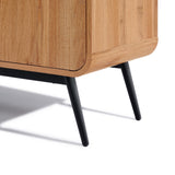 Close-up of the Randolph wood accent sideboard by LuxenHome, featuring walnut with smooth finish and rounded edges. It has black metal legs, offering discreet storage space while displaying a modern and minimalist design.