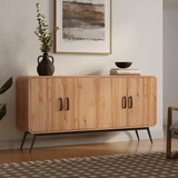 The Randolph wood accent sideboard by LuxenHome features a modern walnut design with four doors and black metal legs for ample storage. Its styled with a dark vase containing greenery, a bowl, and books. An abstract painting hangs above on the wooden floor, complemented by a patterned rug.