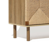 Corner view of a wooden cabinet featuring handcrafted jute woven doors and four cylindrical legs, epitomizing natural modernism.