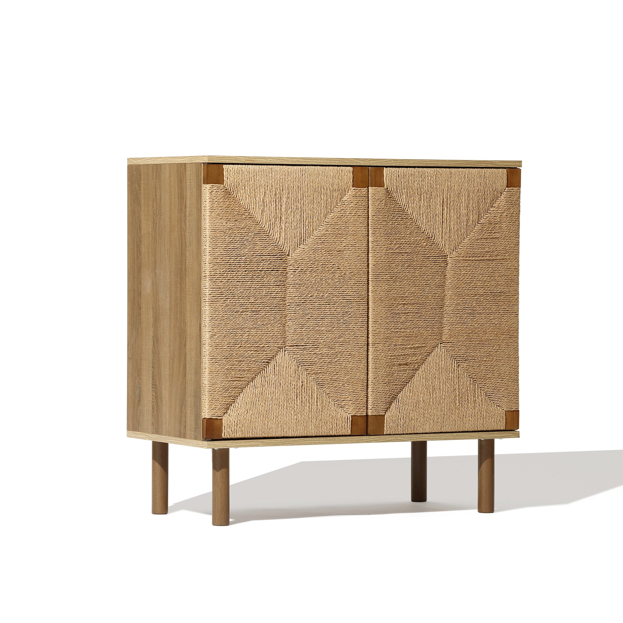 This wooden cabinet epitomizes natural modernism with its jute-woven doors and geometric design, resting elegantly on four legs. A versatile storage solution for any room, it blends style and functionality seamlessly.