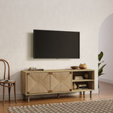 A wall-mounted TV above a wooden console with woven rope facade and efficient cable management holes. A mid-century modern chair, potted plant, and patterned rug complete the rooms stylish aesthetic.