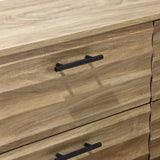 Close-up of LuxenHomes Casper mid-century modern 6-drawer dresser with metal legs, showcasing wooden drawers and black metal handles. The prominent brown wood grain gives a natural texture, while the simple, modern handles contrast with the warm wood hues.