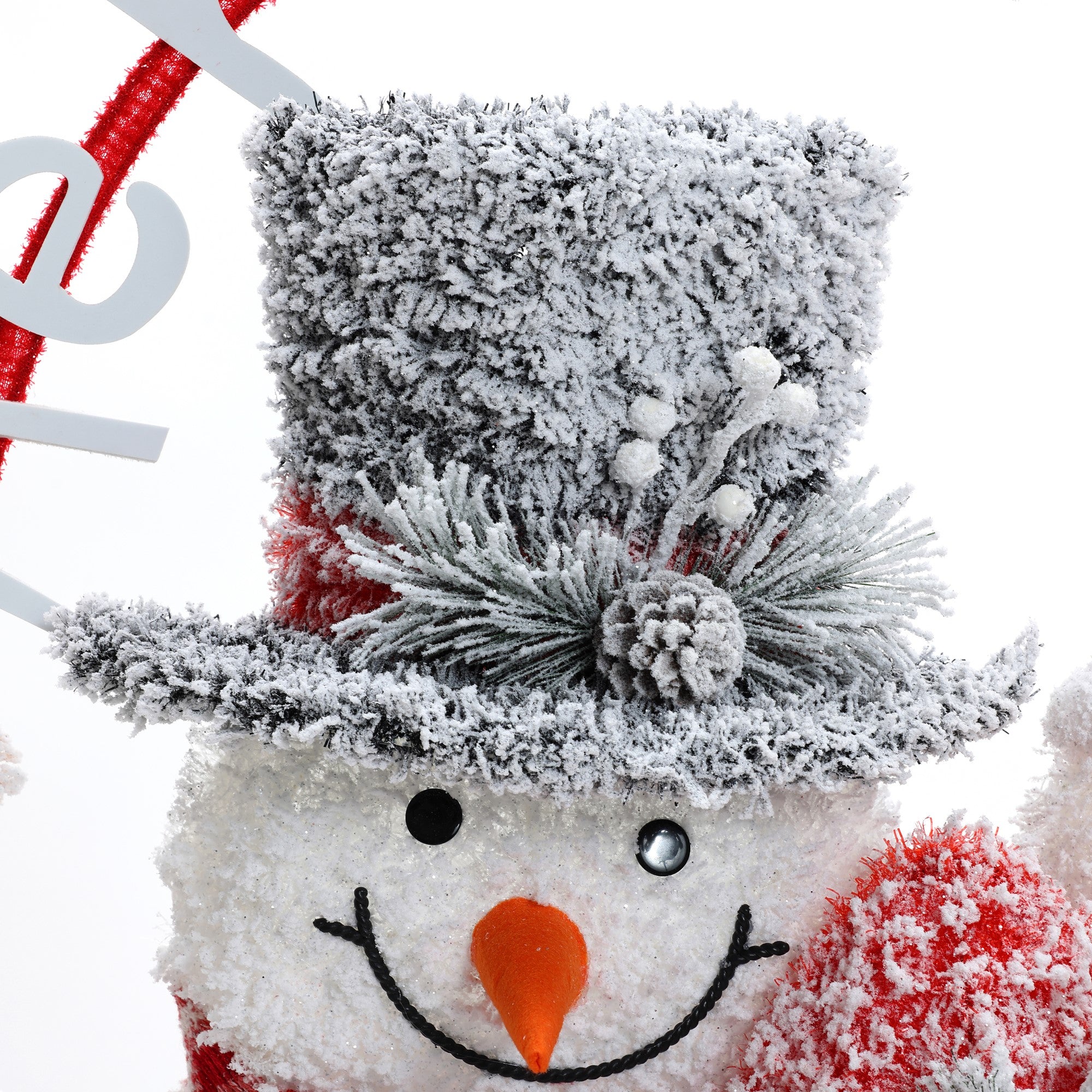 family-of-three-snowmen-is-adorned-with-red-striped-scarves-and-charming-hats