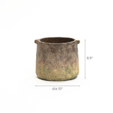 A rustic cement vase, cylindrical in shape, with a 10-inch diameter and 8.9-inch height, features a weathered, textured surface. Its ginger root brown hue adds warmth to any decor.