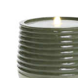 Modern green ribbed ceramic fountain featuring a lit flame atop, enhanced with LED lights for a captivating glow.