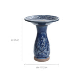 Blue ceramic birdbath with petals and vines pattern