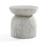 The Rustic off White and Gray Outdoor Side Table, 15.75 high, offers a round concrete design with a wider top, narrower base, and smooth surface showcasing antique weathering in speckled gray for a modern minimalist look.