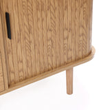 Buffet cabinet sideboard, close-up of a mid century storage cabinet with vertical oak grain, black handle, rounded edge, and one cylindrical leg visible on a white background.