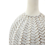 Close-up of a LuxenHome Modern geometric pattern resin tall trumpet vase, 23.5 h, showcasing intricate leaf patterns. It features a smooth, glossy surface with an antique effect enhancing the delicate design against the white background.