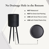 Black dimpled metal cachepot planters with black metal legs