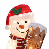 Lighted snowman outdoor holiday decoration wearing a red Santa hat and scarf, holding a snow-covered measuring stick with letters and numbers—perfect for festive yard holiday decor.