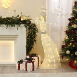 Pre-lit angel stands by the fireplace, with wrapped presents ,a decor christmas tree.