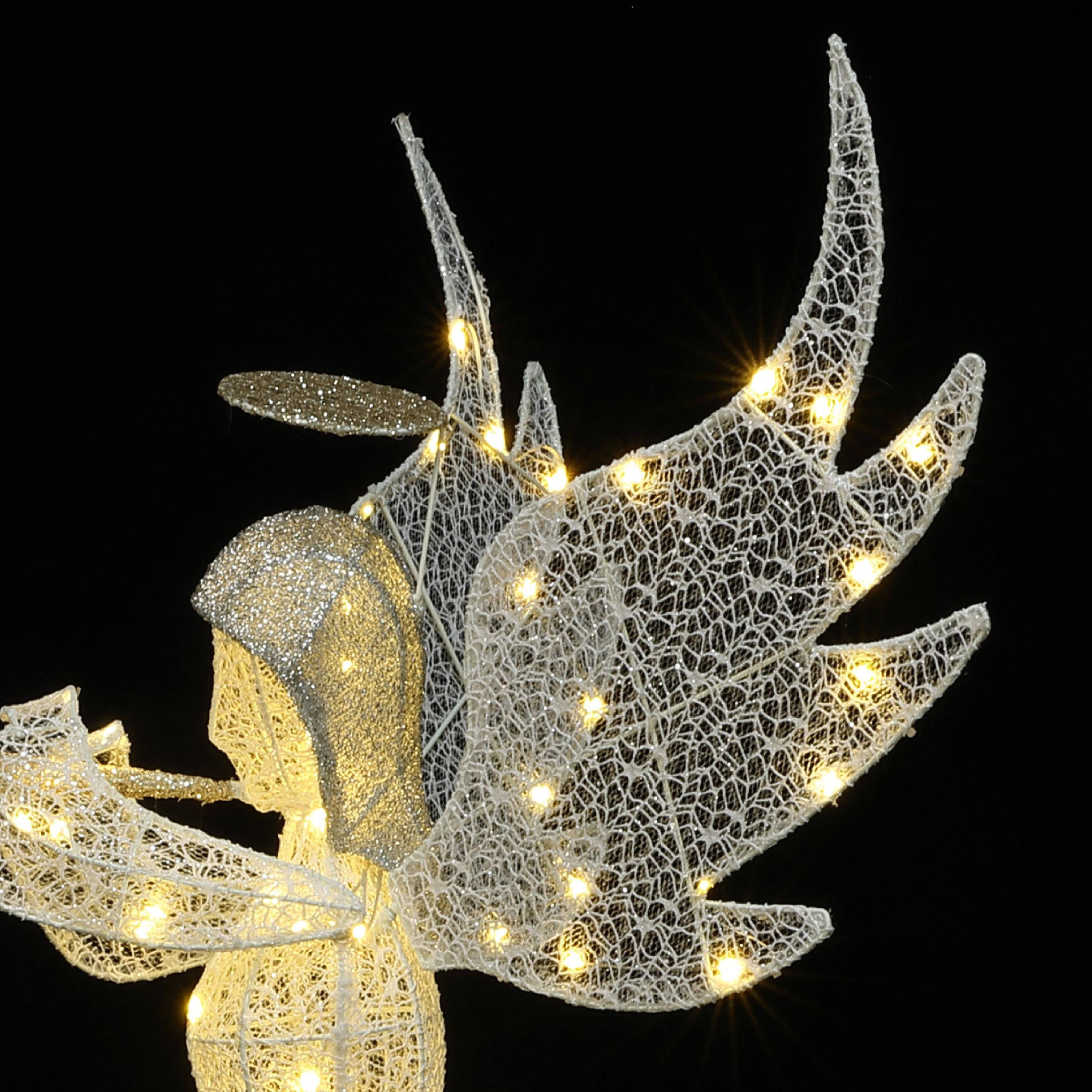 Wireframe outdoor angel decor with illuminated wings ,halo, decor with string lights.