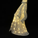Pre-lit angel wire mesh dress-shaped sculpture with glowing lights inside , glittery ribbon at the waist.