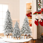 3 snow-frosted christmas trees with realistic snow-flocked branches ,wrapped gifts, red stockings hanging by white fireplace.