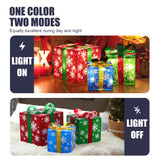Three decorative LED gift boxes with snowflake patterns are shown with lights on in a dark room and off in daylight.