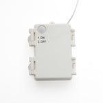 White rectangular electrical box with round sensor,labeled options: 1. ON, 2. OFF. A wire extends from the top.