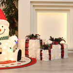 3 decor gift box presents with white textured wrapping,plaid ribbons ,next to lighted snowman figure.