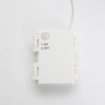 White plastic control box with small button, printed ON/OFF options. A single wire extends from the top.