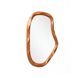 Irregularly shaped asymmetrical wall mirror with a smooth, wavy wooden frame, adding a touch of home décor.