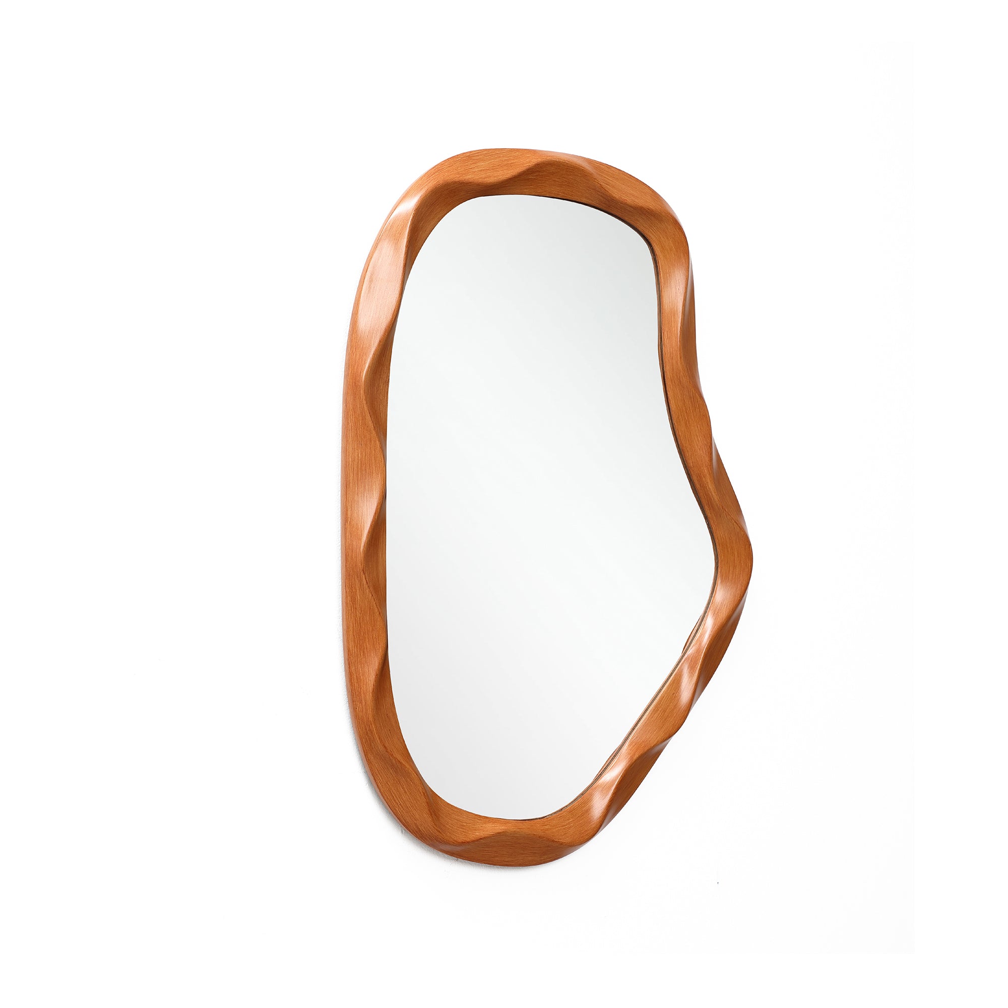 Irregularly shaped asymmetrical wall mirror with a smooth, wavy wooden frame, adding a touch of home décor.
