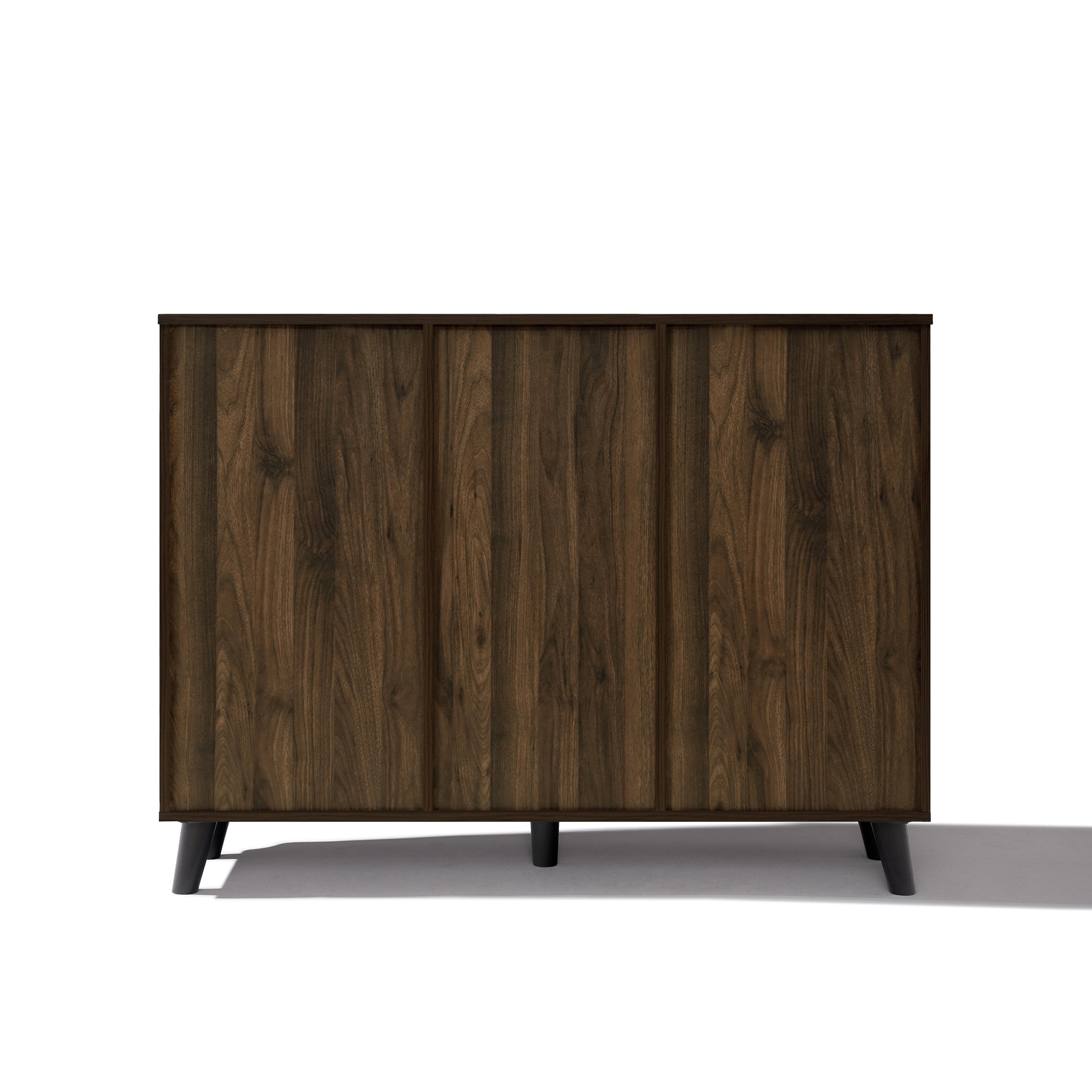 Dark wood sideboard cabinet with three vertical panels, short black legs, offers stylish dining room storage.