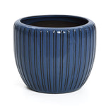 A dark blue flowerpot with a three-dimensional vertical pattern, empty and set against a plain white background.