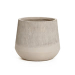 Beige ceramic pot with a textured upper half and smooth lower, reminiscent of a natural wood pattern, set against a white background.