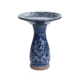 Blue ceramic birdbath with petals and vines pattern