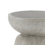 A close-up of the LuxenHome 19.7 rustic off-white and gray concrete outdoor side table, showcasing its modern, minimalist round shape made from durable MgO material, with a speckled textured surface and smooth rim against a plain background.