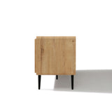 Side view of a minimalist TV stand with a light natural finish and four black legs with a shadow to the right.