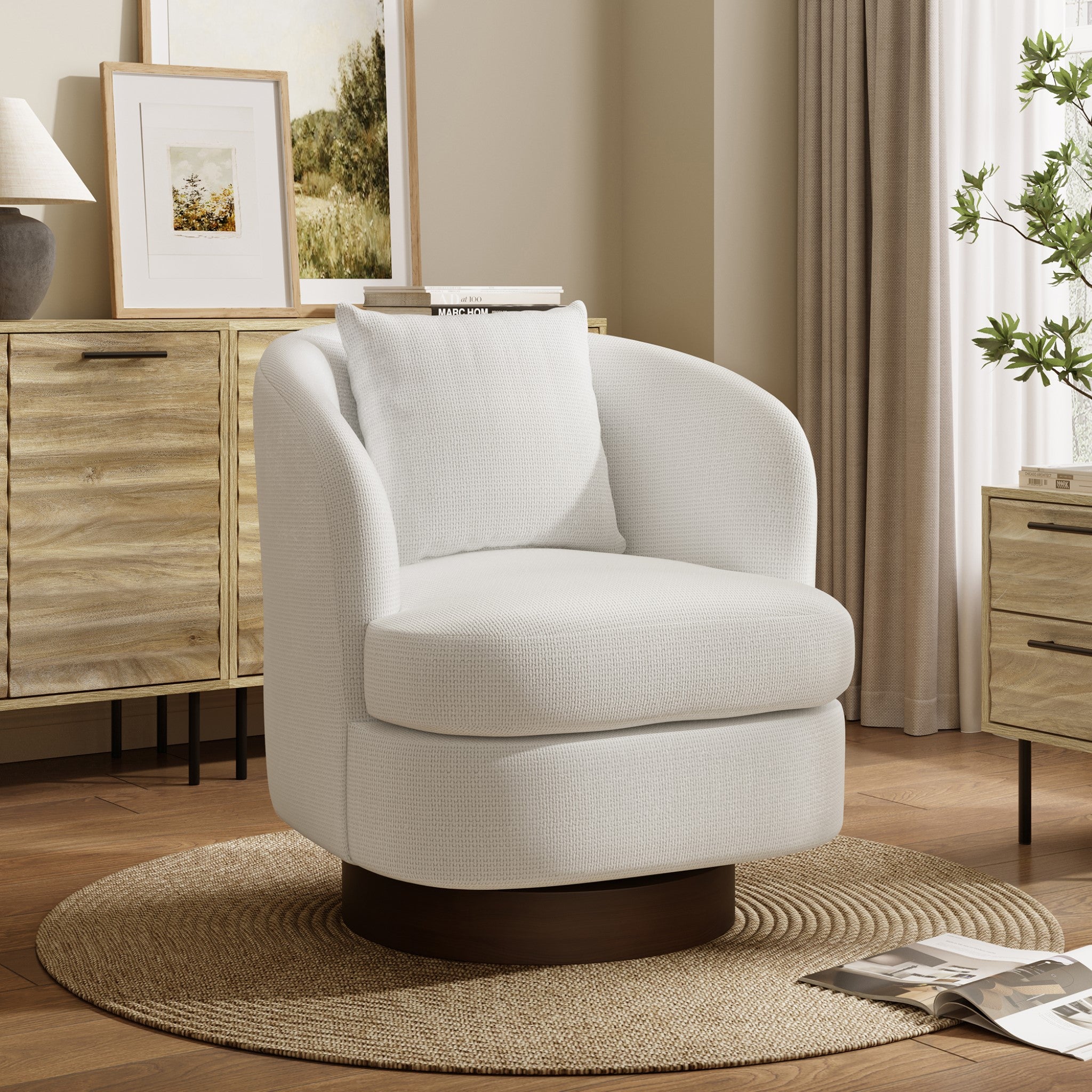 white janice upholstered swivel accent chair with dark wood accent base by the side of a white fluted end table