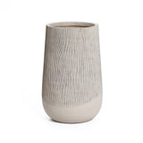 A tall, cylindrical beige vase with a textured upper half and smooth lower half embodies the elegance of a contemporary style planter on a sleek white background.