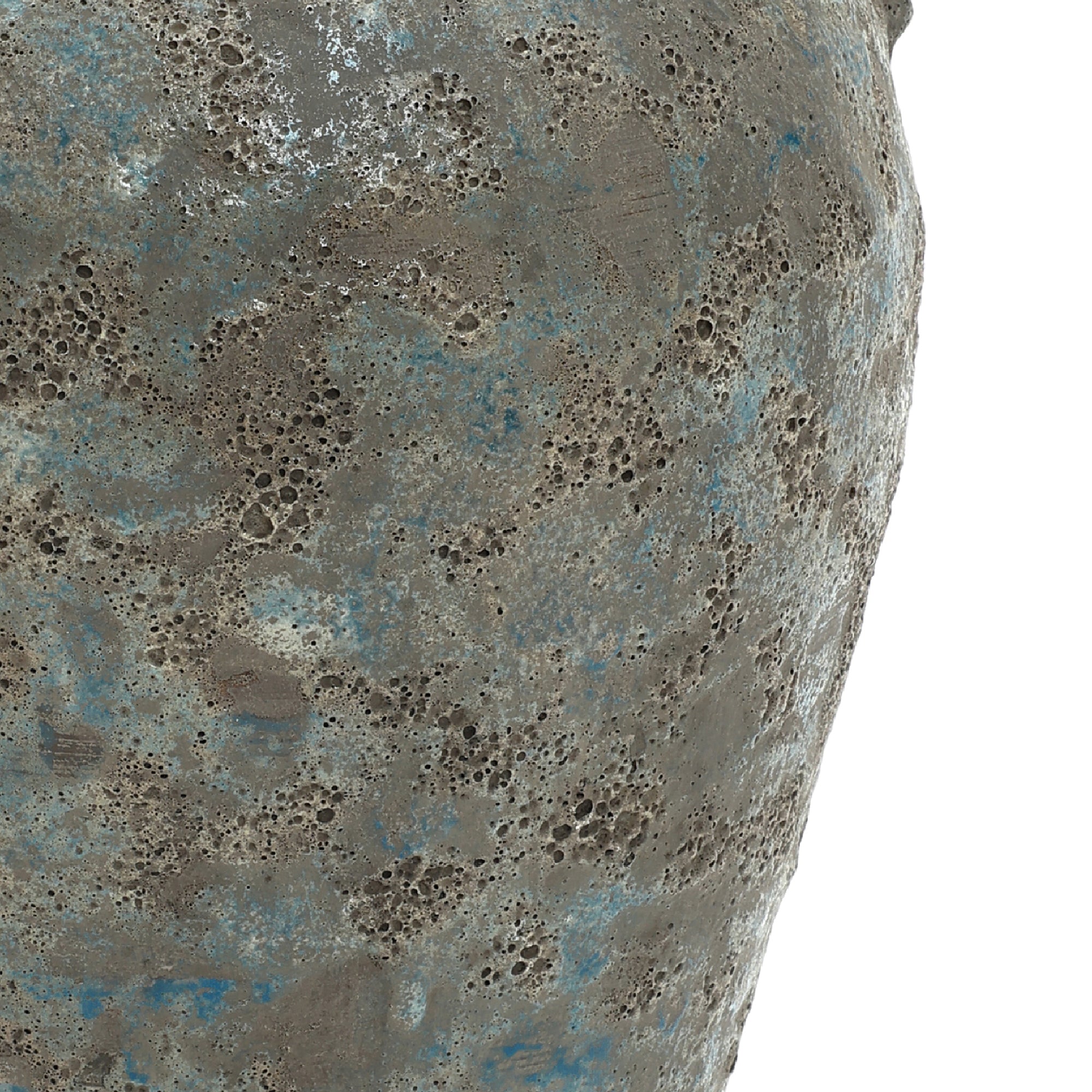 Close-up of a textured surface on a ceramic vase object, showing pitting and rough patches.