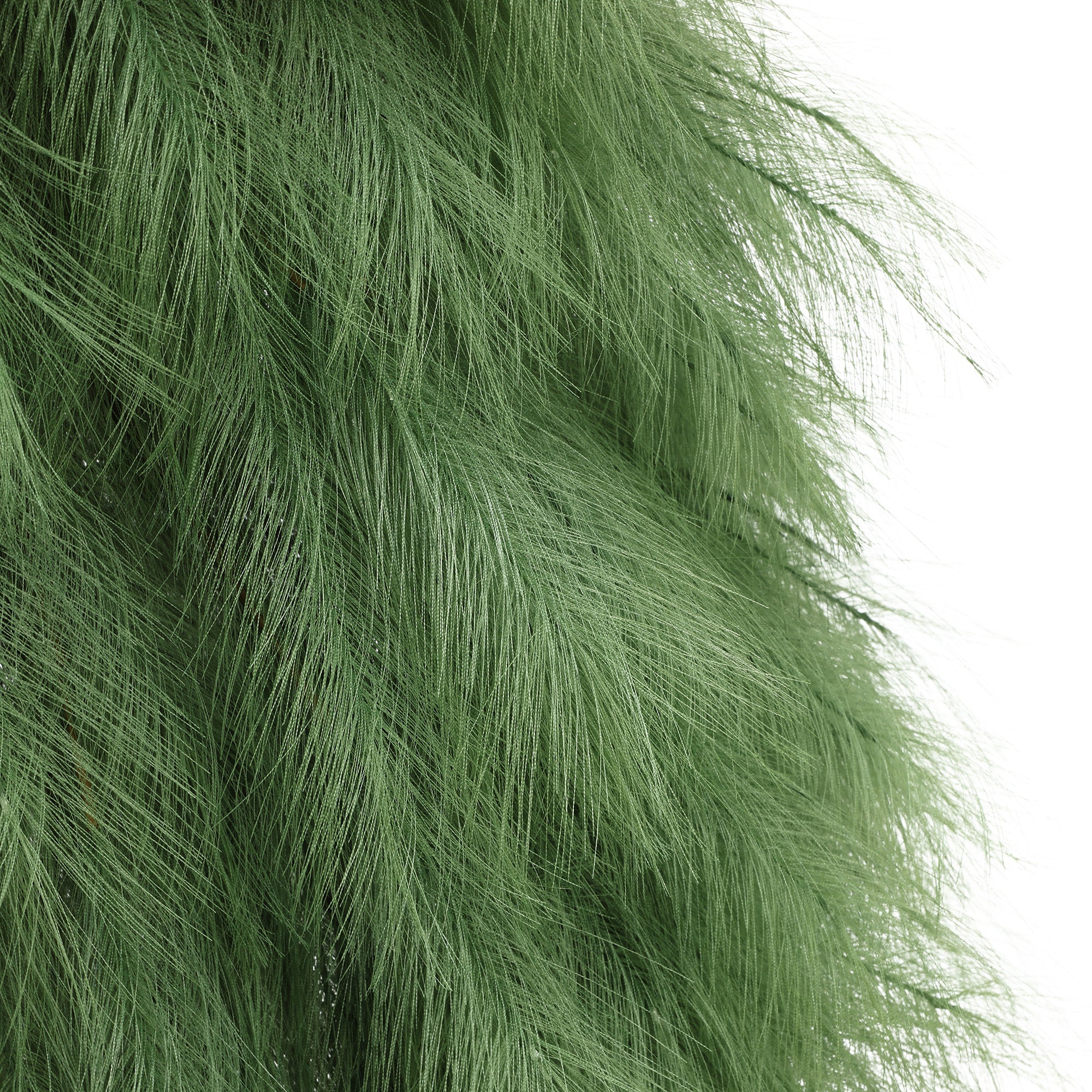 Close-up of green, feathery Artificial Pampas Grass Tree foliage against white background.