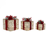 3 decor gold wire gift boxes with red ribbons, led lights, greenery, arranged in descending size againstwhite background.