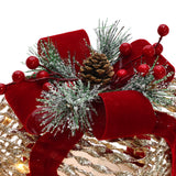 Decor arrangement featuring red bow, pine branches with white frost, red berries, pinecone on gold background.