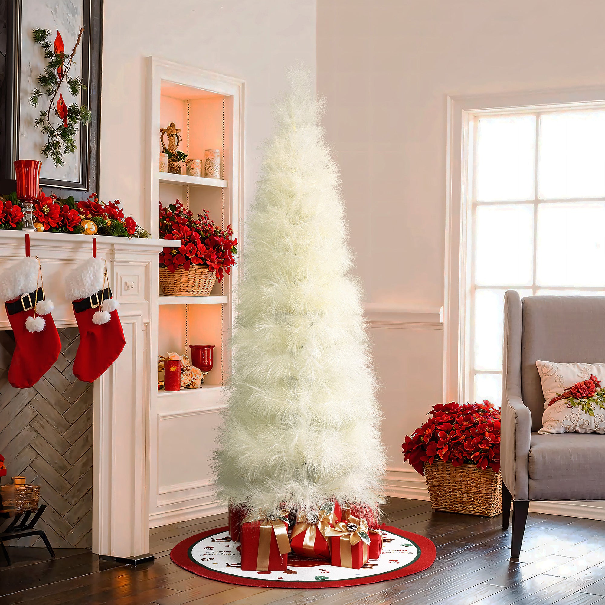 White christmas tree stands amidst red ,gold presents in living room adorned with poinsettias, red stockings.