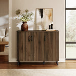 Mid-century walnut cabinet with three doors stands against a wall, topped with a vase of flowers, framed art.