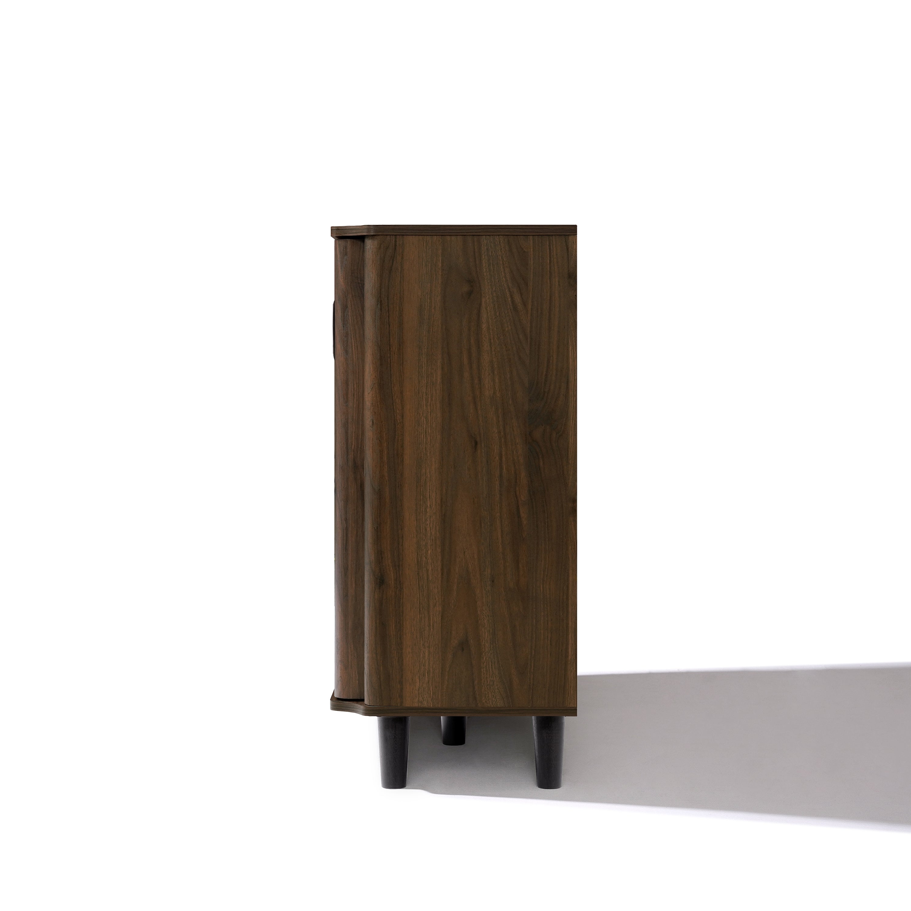 Mid-century walnut wood sideboard cabinet with a dark finish is shown from the side, standing on four black legs.