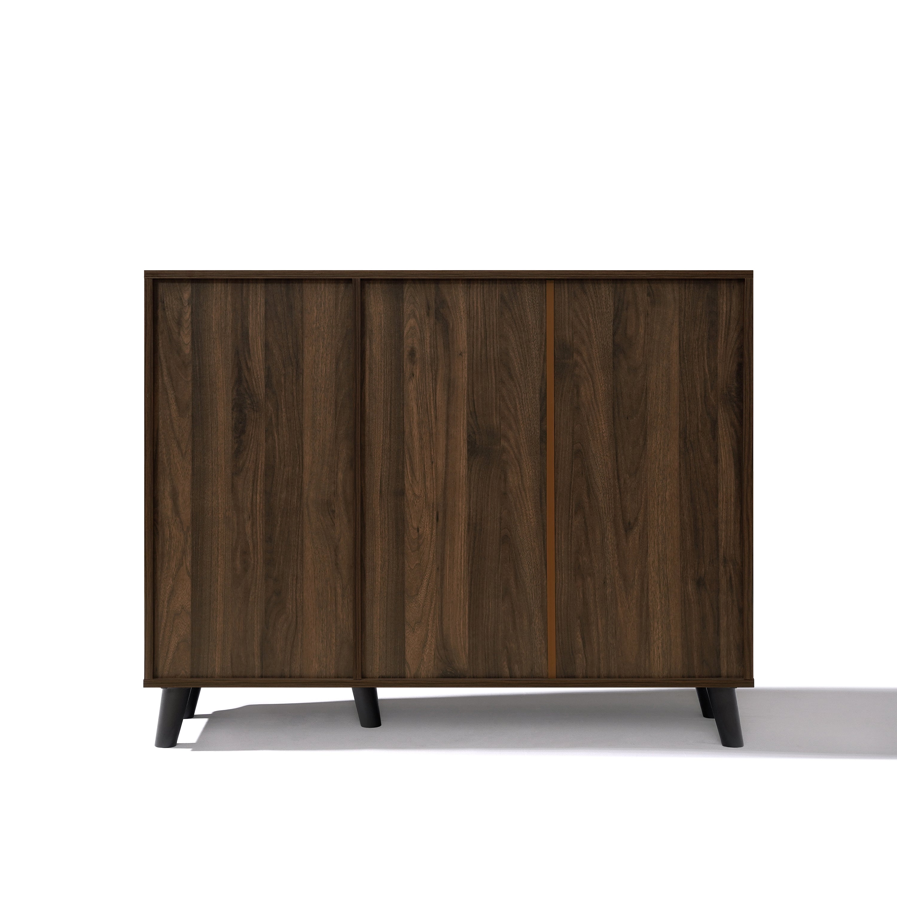 A mid-century walnut storage cabinet with two sliding doors and short black legs.