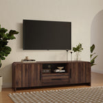 A wood TV console tables stand with books decor items.