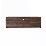 A wood TV console tables featuring a central circular hole for cable management.
