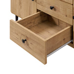 Wood buffet cabinet with black knobs, shown with one drawer pulled open to reveal its ample storage inside.