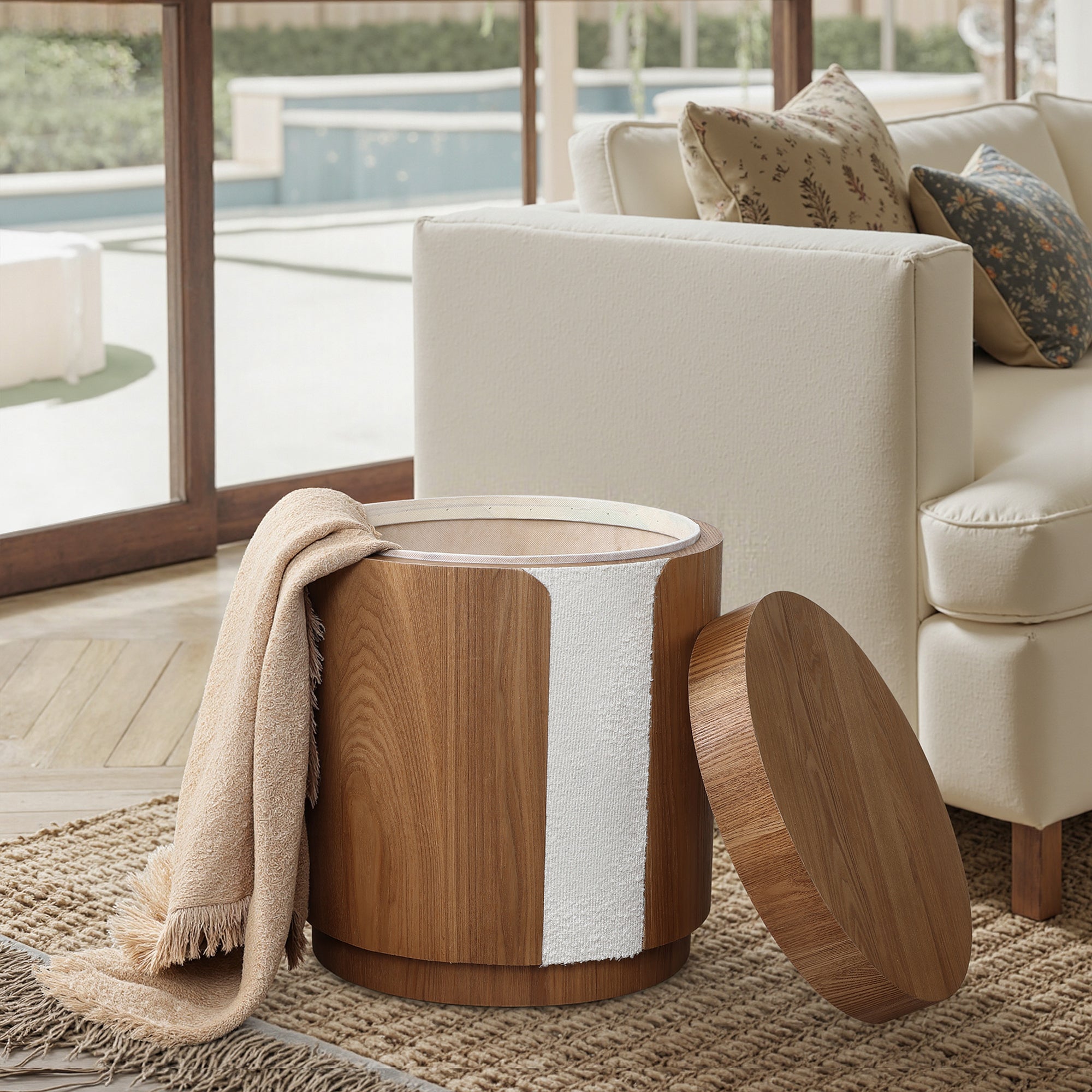 Round wood storage side table with modern elegance, its lid removed and leaning on the side.